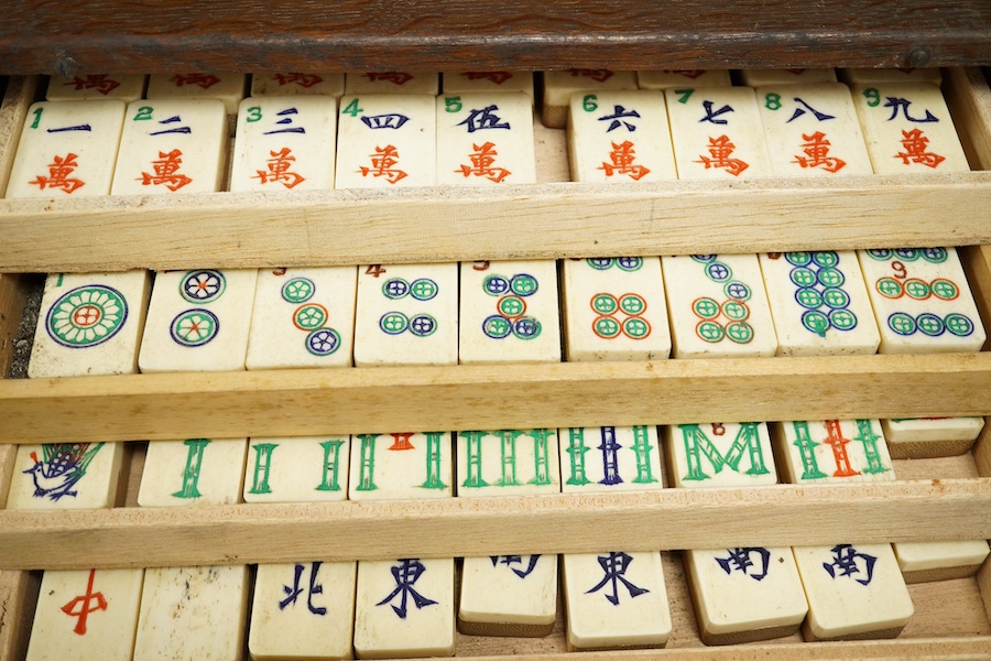 A Chinese bone mahjong set, cased, 23cm wide. Condition - fair